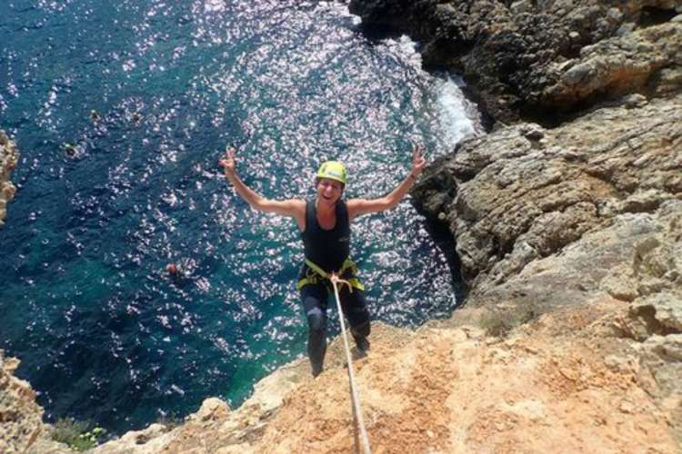 Boy-jumping-from-a-rock-Mallorca