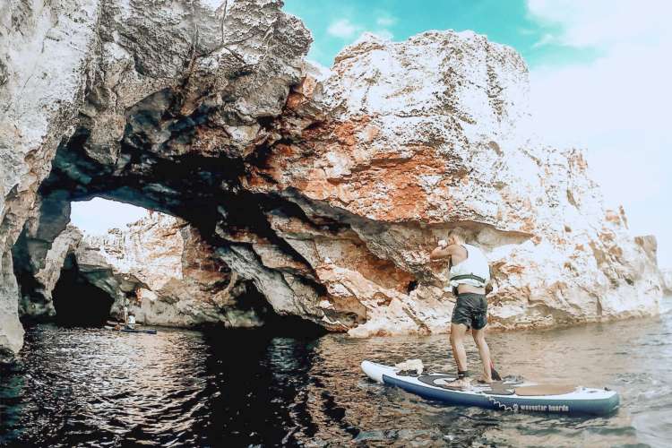Paddle-surfing-in-caves-in-Menorca