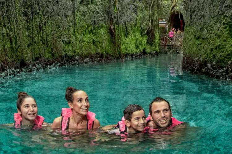 Family-in-a-cenote-at-Xcaret-Park